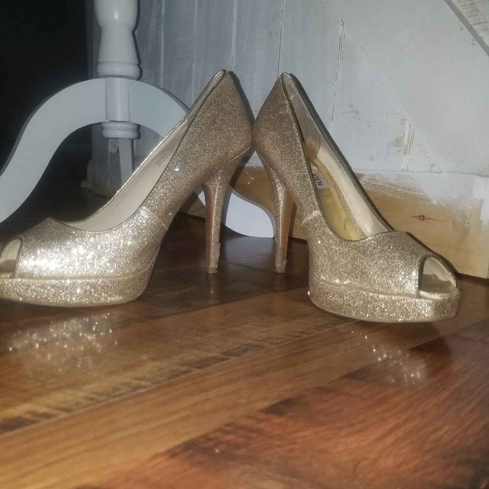 Goldish sparkly shoes.